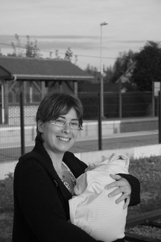 My wife &amp;amp; son (in the white bag) this summer